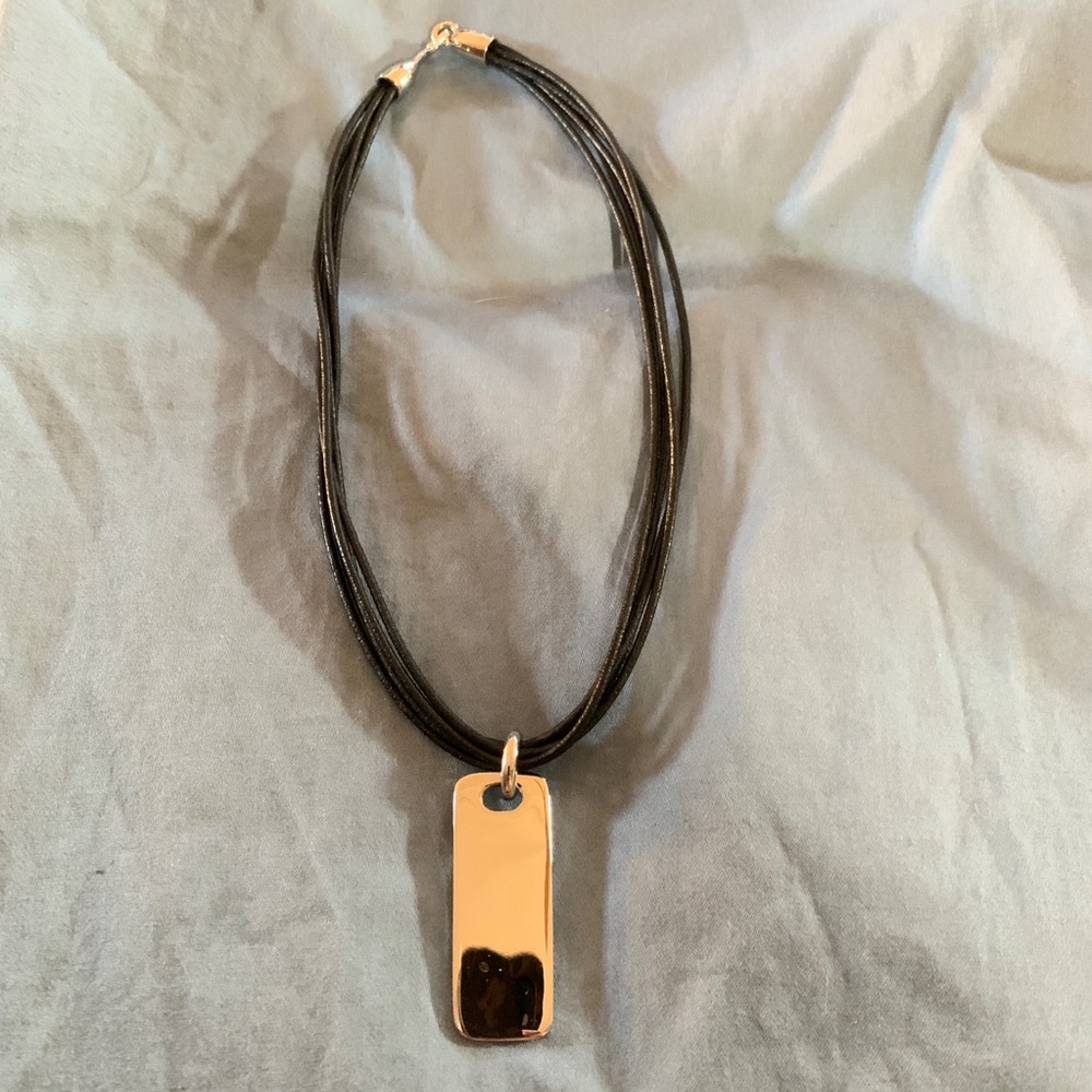 Nine West silver pendant on multi strand cord